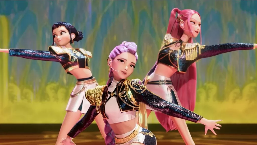 Personagens da animação ‘Guerreiras do K-Pop’ dançando no palco com figurinos brilhantes e coloridos, mostrando coreografias inspiradas no K-pop | Rolling Screenn